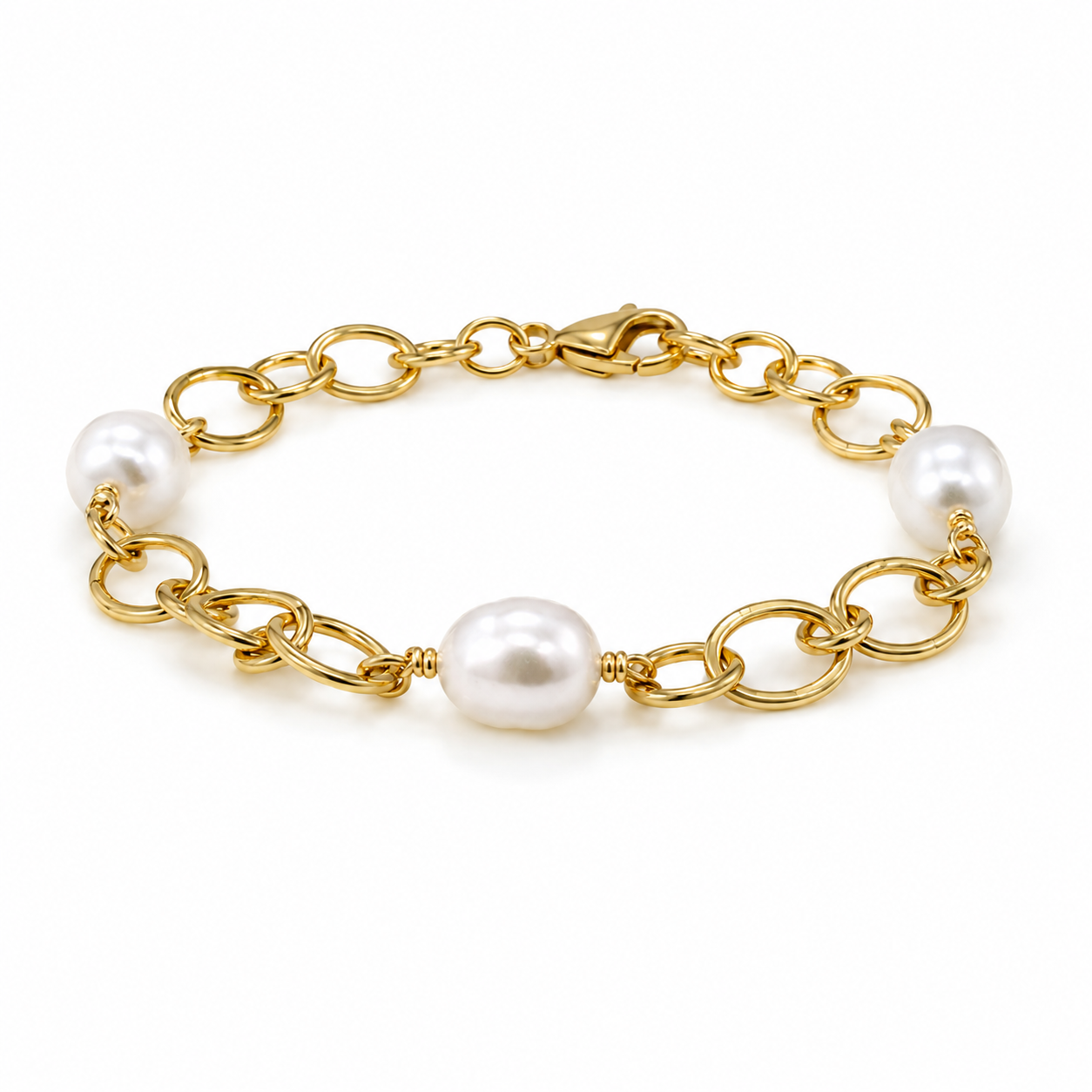 Australian South Sea pearl bracelet featuring three lustrous white pearls and a bold gold vermeil link chain