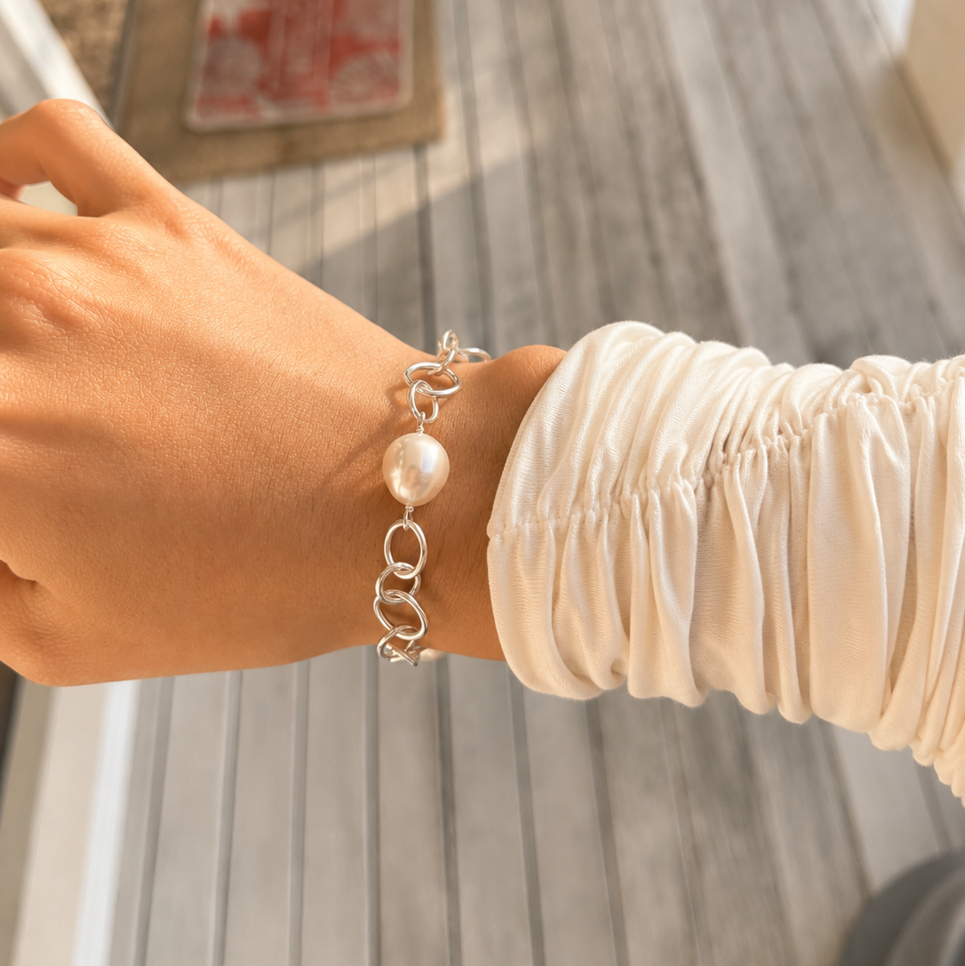 Australian South Sea pearl bracelet featuring three lustrous white pearls on a polished 925 sterling silver link chain
